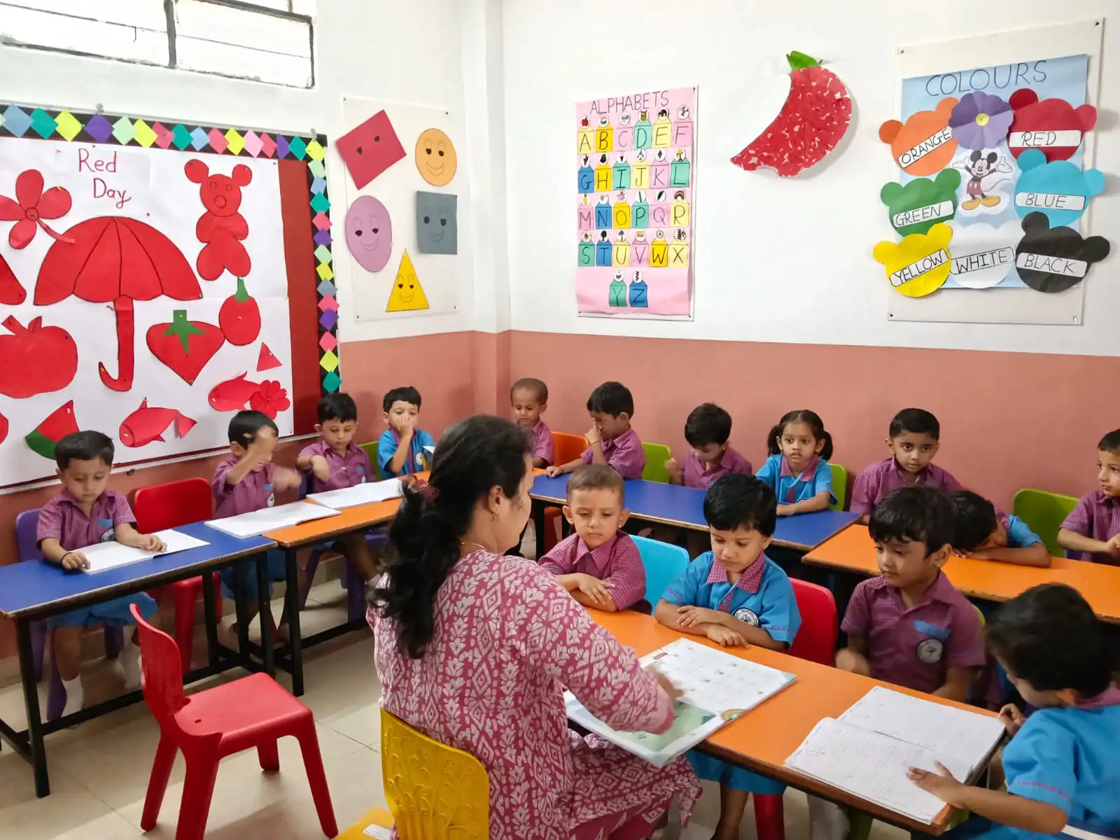 Navoditya School teacher guiding early writing in classroom
